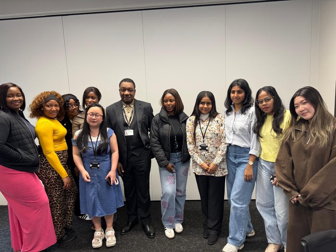 Dr. Ayokunnu Olowoporoku with a cohort in a seminar room